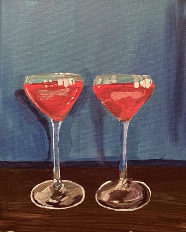 two pink cocktails in small stemmed glasses