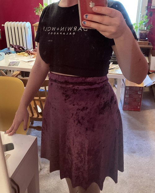 photo taken in a mirror of a crushed velvet purple skirt